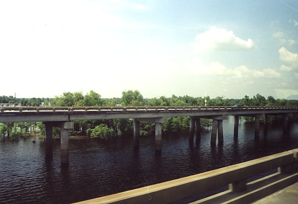 The highway between Lafayette and Baton Rouge traverses the Atchafalya swamp, and for miles and miles the road runs on a low bridge. Every once in a while, at some small island there would be a off-ramp, and fishing boats next to the shore.